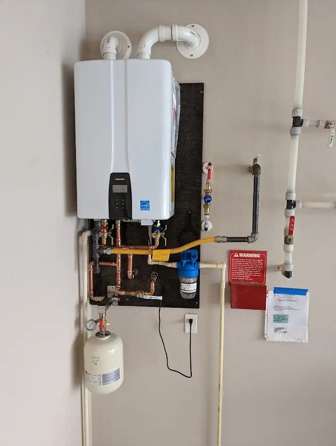 Professional plumber installing copper piping in a Centerville home